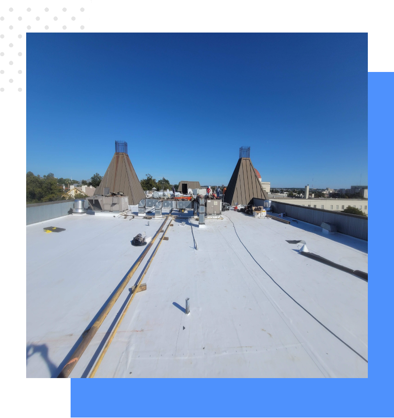 A photo of the roof of a building with snow on it.