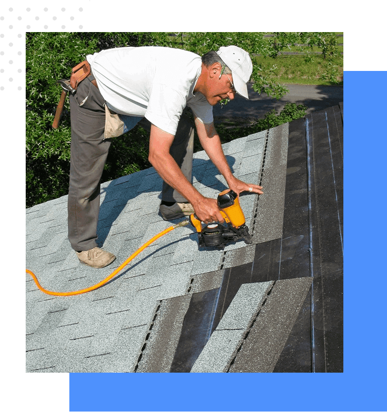 A man is using an electric sander to cut the asphalt shingles.