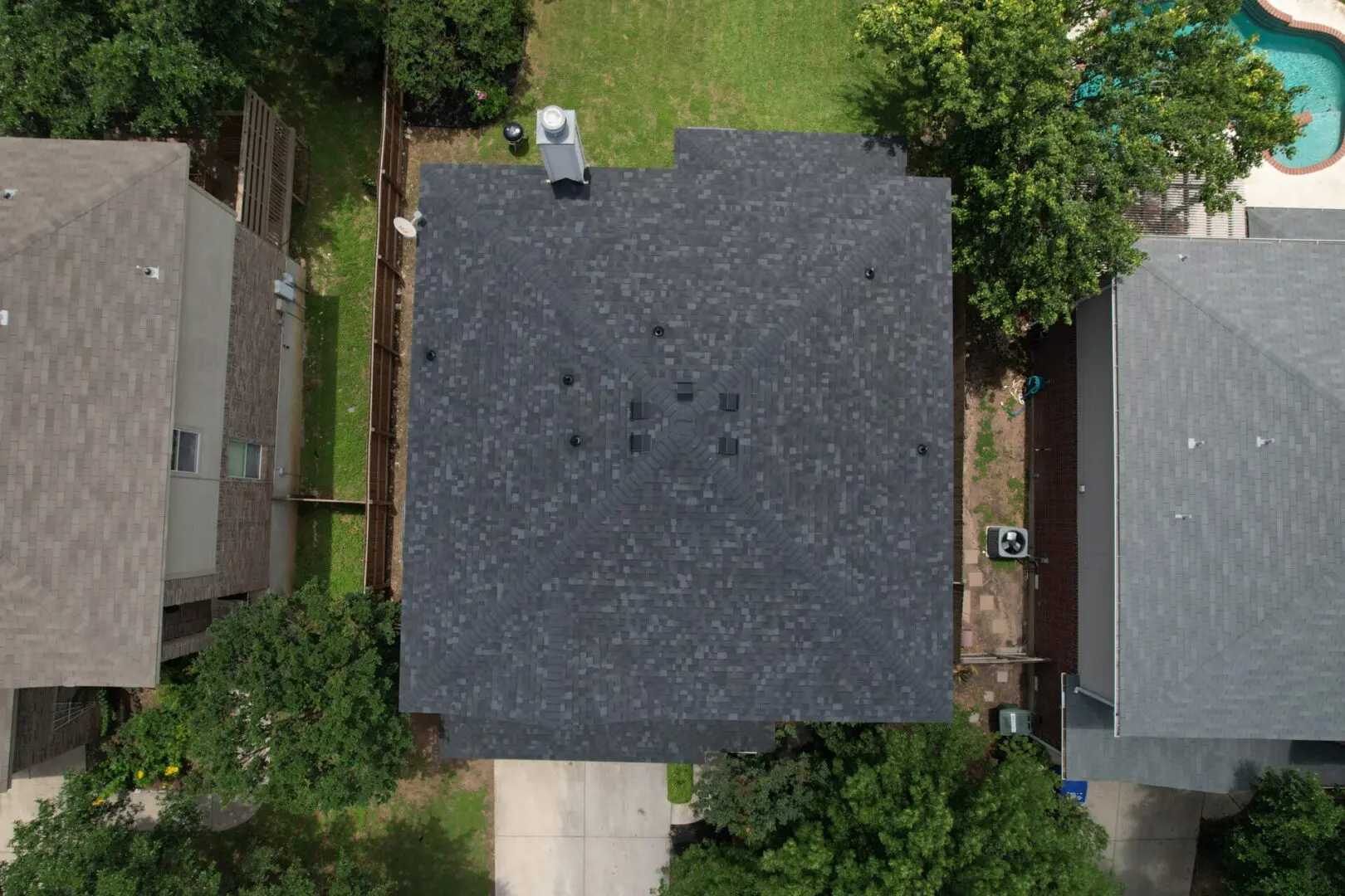 A person standing on the side of a house.