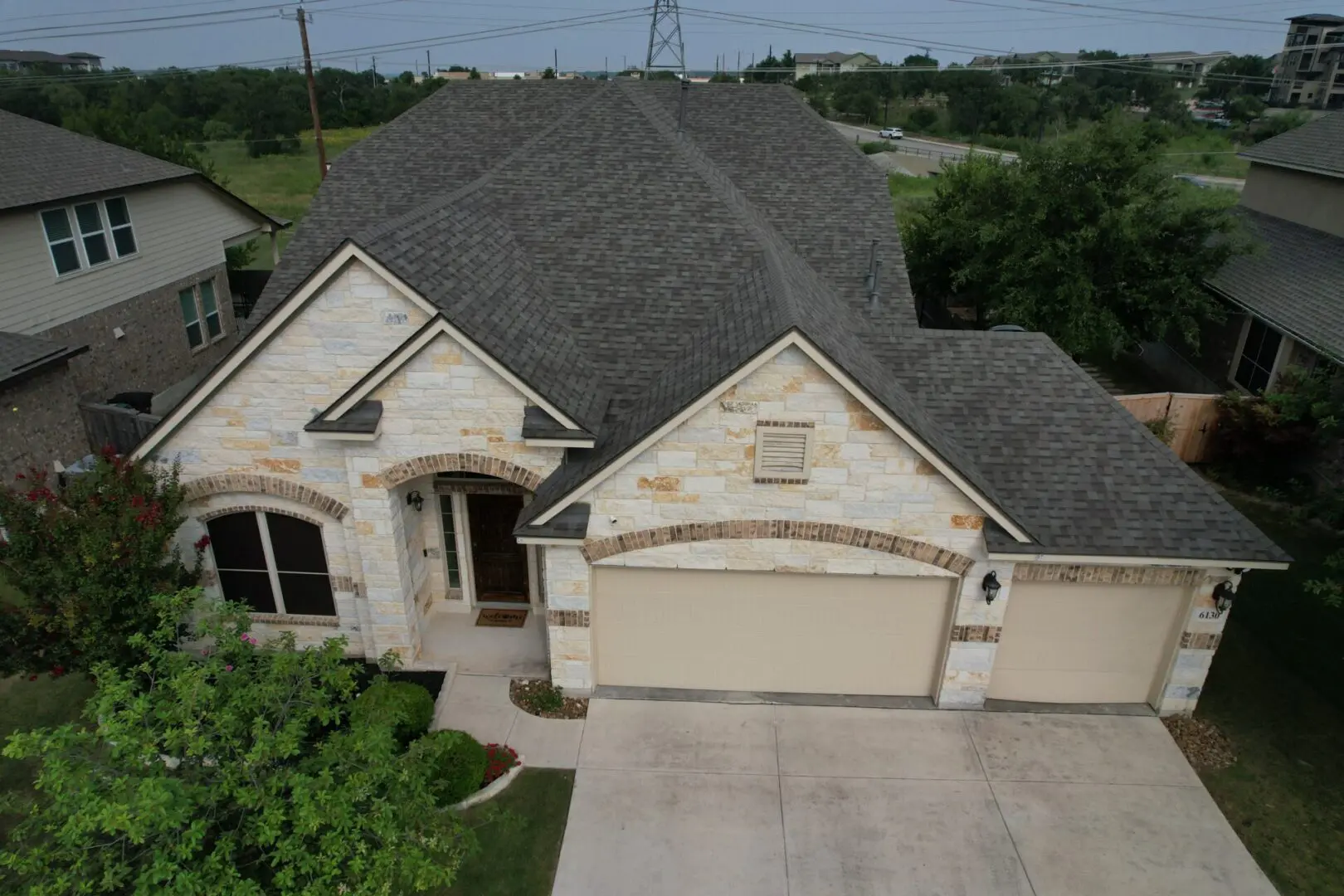 A house with a garage and a driveway.