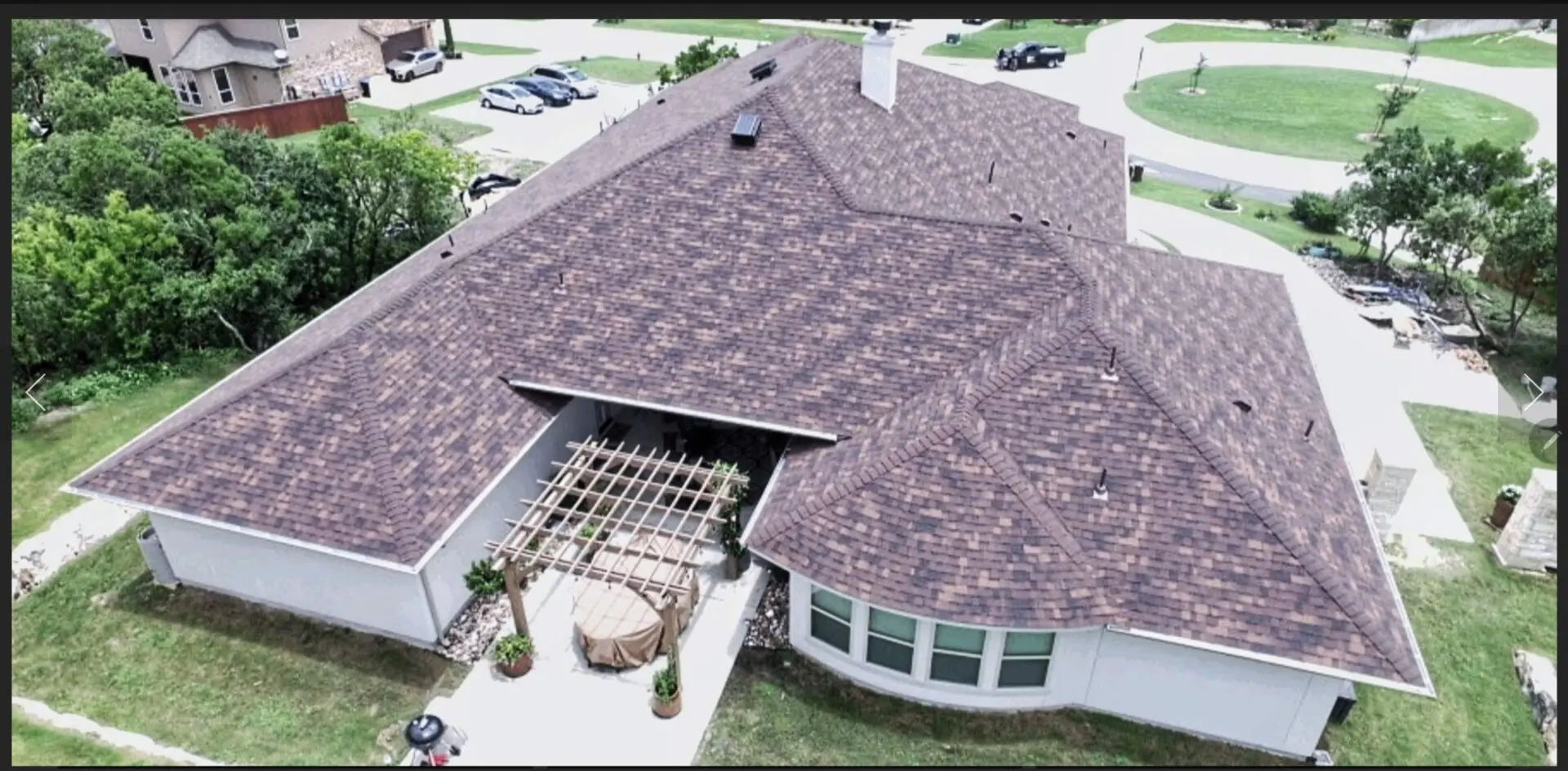 A large house with a patio and a gazebo.