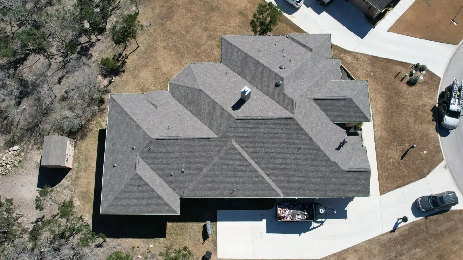 A house with a roof that has been cut off.