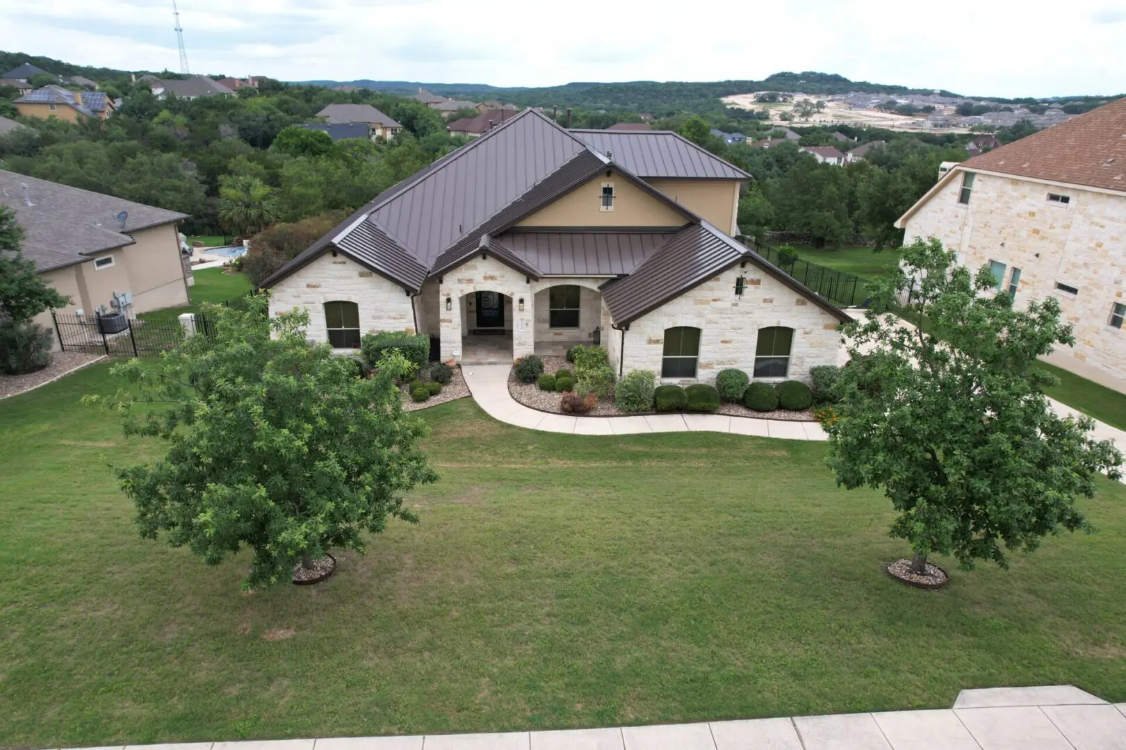 A large house with a lot of trees in the yard