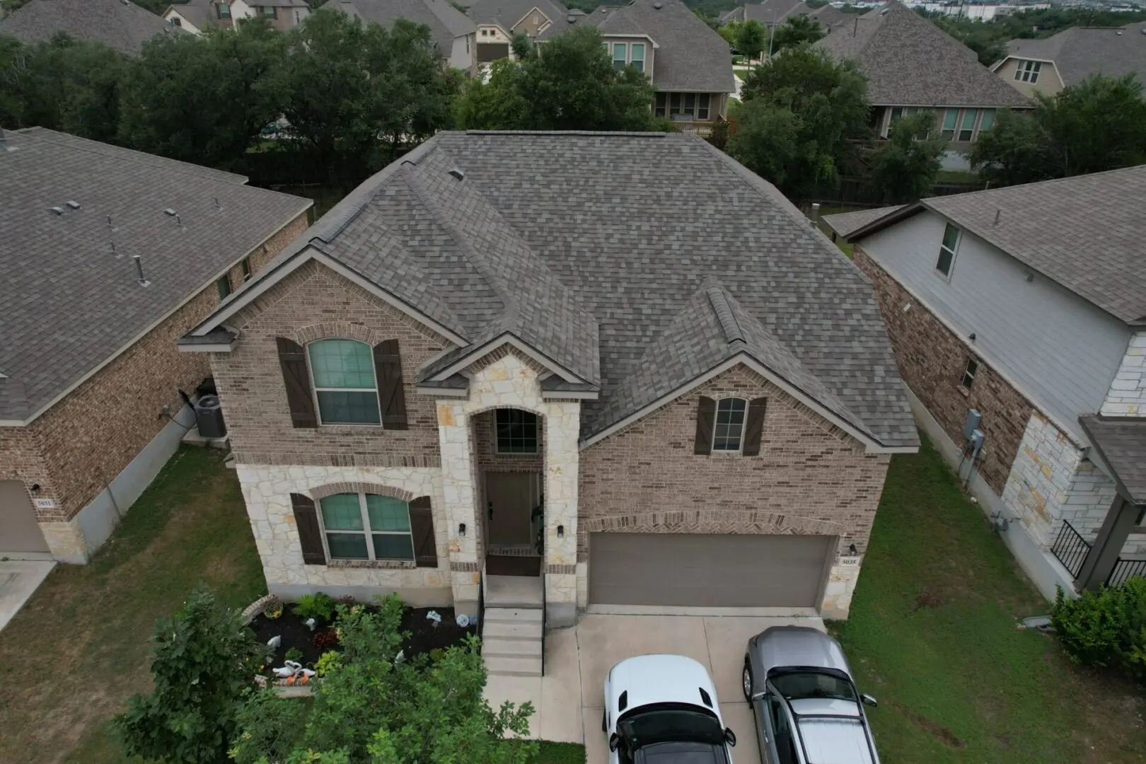 A house with a car parked in front of it.