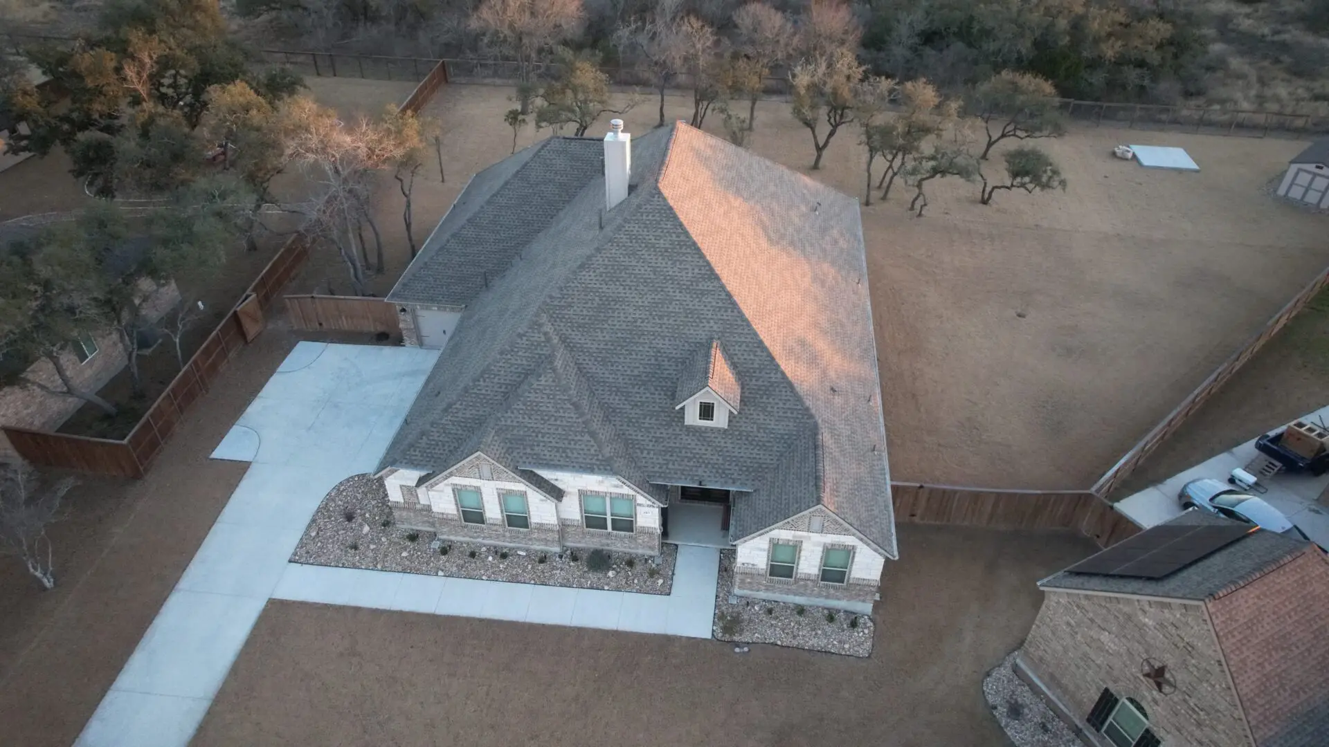 A house with a lot of trees in the background